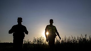 Members of the Lithuania State Border Guard Service patrol on the border with Belarus, near the village of Purvenai, Lithuania