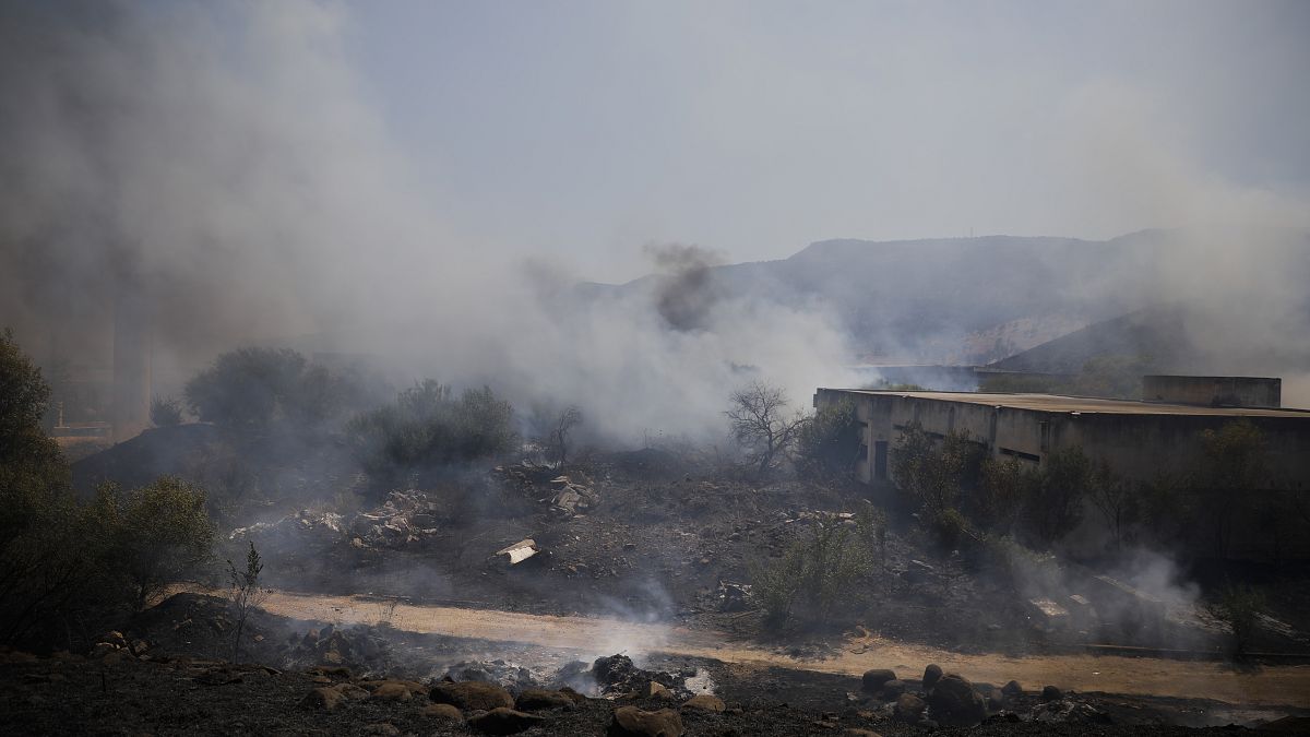 Fields burn following a hit by a rocket fired from Lebanon into Israeli territory, near the northern Israeli town of Kiryat Shmona, Wednesday, Aug. 4, 2021. 