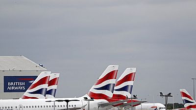 British Airways passenger planes are pictured at the apron at Heathrow Airport as the UK government's 14-day quarantine for international arrivals starts on June 8, 2020.
