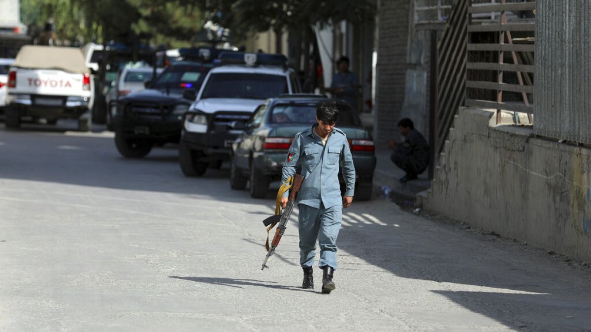 Afghan security personnel arrives at the area where the director of Afghanistan's Government Information Media Center Dawa Khan Menapal was shot dead in Kabul.
