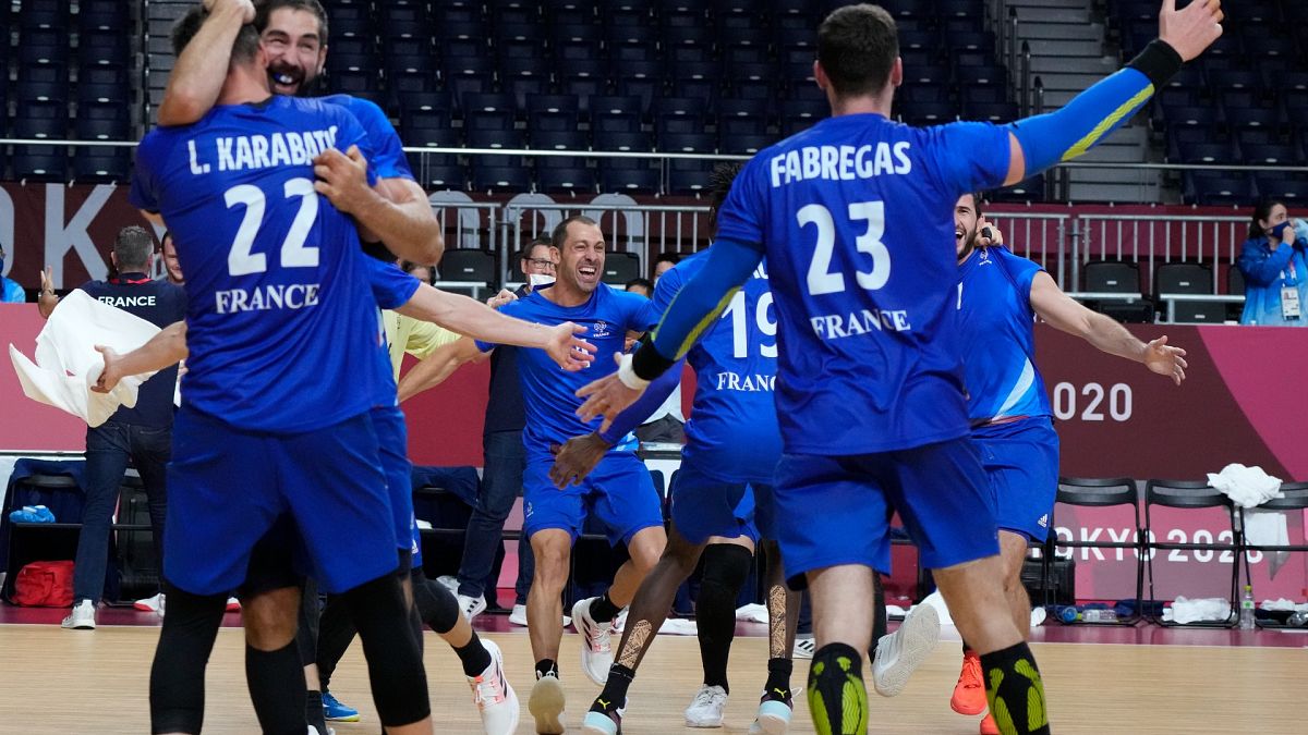 France players celebrate as they won the men's gold medal handball match between France and Denmark at the Tokyo 2020 Summer Olympics, Aug. 7, 2021.