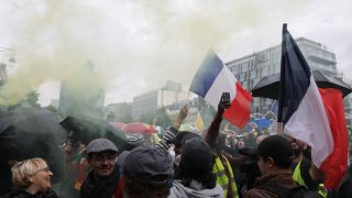 Vaccine passport protesters gather during a demonstration in Paris, France,  Aug. 7, 2021.