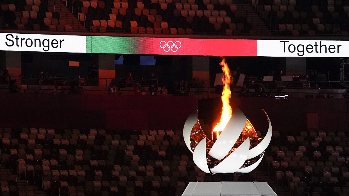 The Olympic flame burns during the closing ceremony in the Olympic Stadium at the Tokyo 2020 Summer Olympics, Aug. 8, 2021