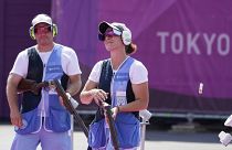 Gian Marco Berti, left, Alessandra Perilli, both of San Marino won silver in the mixed team trap at the Tokyo 2020 Summer Olympics .