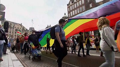 In Amsterdam, thousands of people take part in the Pride Walk