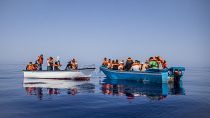 Des migrants probablement tunisiens sont secourus par l'association Open Arms au large de l'île italienne de Lampedusa, le 29 juillet 2021