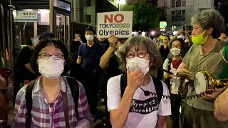 Anti-Olympics protesters gather outside Tokyo stadium