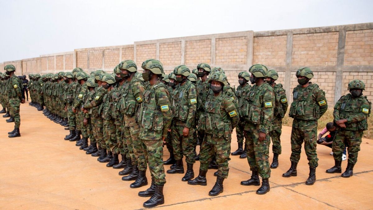 Rwandan armed forces prepare to board a flight to Mozambique
