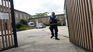 A French gendarme stands at the entrance of the place where a French catholic priest, aged 60, has been murdered in Saint-Laurent-sur-Sevres, Western France, on August 9, 2021