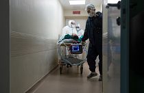 Medics transport a patient with COVID-19 at the City hospital No. 52 for coronavirus patients in Moscow, Russia, July 13, 2021.