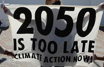 Activists protest for climate justice outside parliament in Cape Town, South Africa,