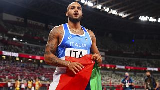 Lamont Marcell Jacobs of Italy celebrates after winning gold in the final of the men's 4x100m relay at the Tokyo 2020 Summer Olympics, Aug. 6, 2021,