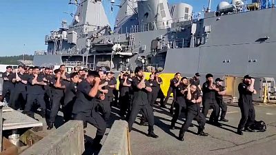 New Zealand navy personnel welcome colleagues aboard warship with powerful haka