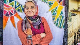 Egyptian batik designer Samar Hassanein poses for a picture at her workshop in el-Fustat area of Old Cairo, on June 28, 2021.