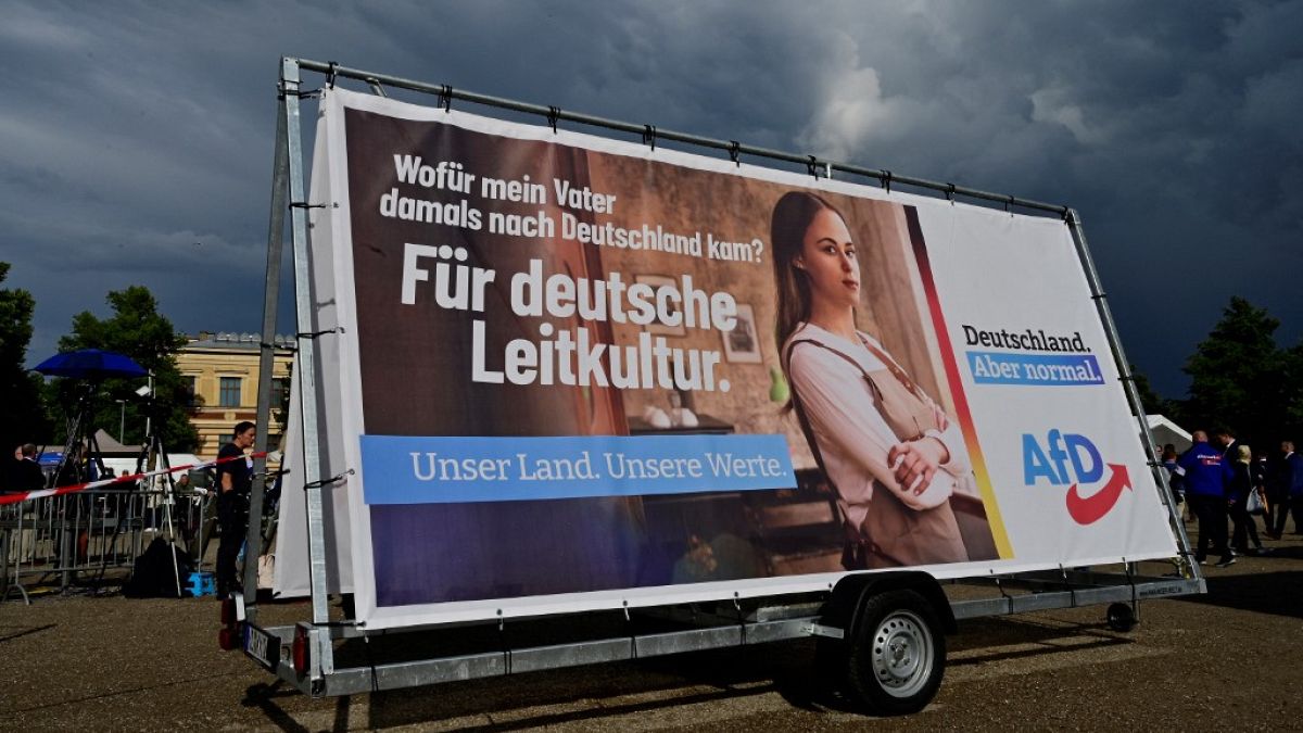 An election campaign poster with the slogan 'For German leading culture' is seen during a rally of far-right AfD party for the launch of the electoral campaign on August 10.