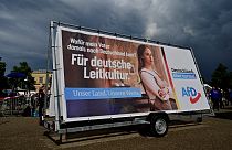 An election campaign poster with the slogan 'For German leading culture' is seen during a rally of far-right AfD party for the launch of the electoral campaign on August 10.