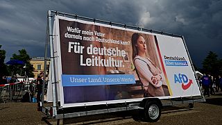 An election campaign poster with the slogan 'For German leading culture' is seen during a rally of far-right AfD party for the launch of the electoral campaign on August 10.