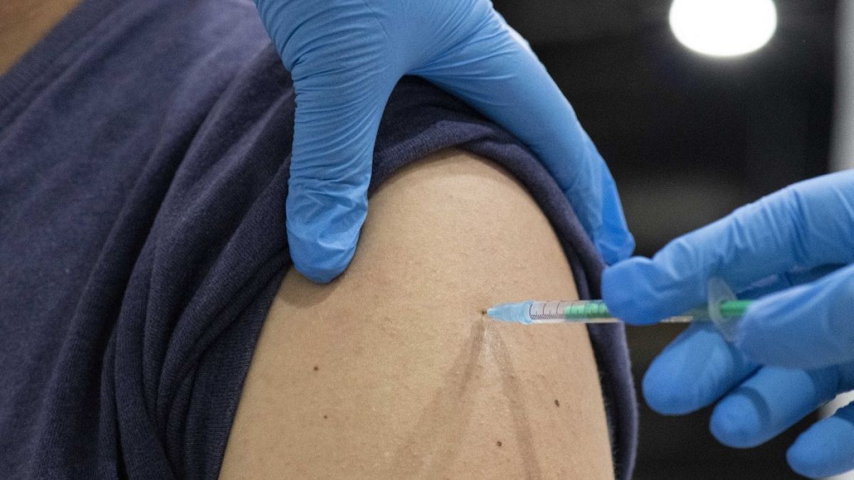 A man gets his vaccination with the Johnson & Johnson vaccine at the district vaccination center in Ludwigsburg, southern Germany, on August 3, 2021.