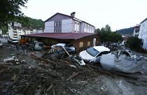 Destroyed cars in a street after floods and mudslides in Bozkurt town of Kastamonu province.