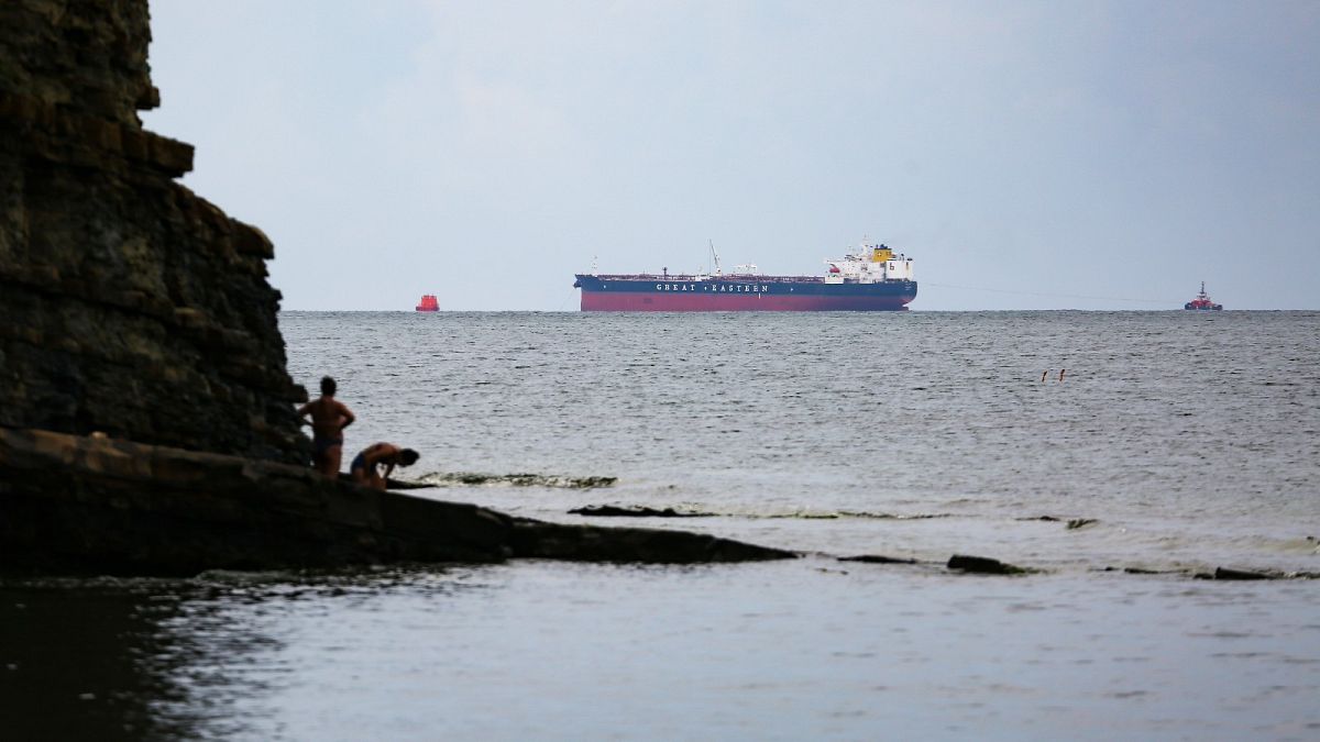 The Minerva Symphony tanker, which sails under the Greek flag is seen at the Black Sea coast after an oil spill, near Novorossiysk, Russia.