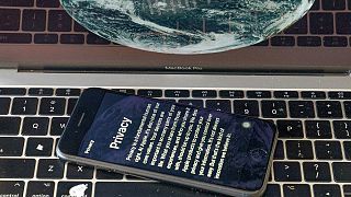 his Oct. 2, 2020 file photo shows an iPhone screen with Apple's privacy policy reflected on a laptop screen in Los Angeles.