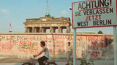 The graffiti-covered Communist wall close to the Brandenburg Gate in Berlin, sometime in 1988.