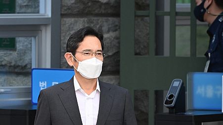 Lee Jae-yong, jailed de facto leader of the giant Samsung group, walks out as he is released early on parole at the Seoul Detention Center in Uiwang on August 13, 2021.
