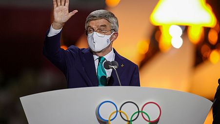 International Olympic Committee's President Thomas Bach waves during the closing ceremony in the Olympic Stadium at the 2020 Summer Olympics.