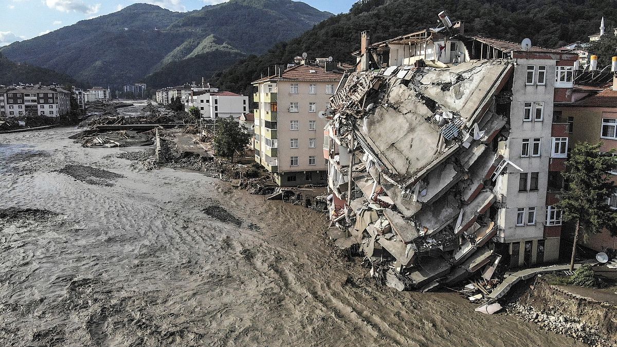 An aerial photo shows destroyed buildings after floods and mudslides killed about two dozens of people, in Bozkurt town of Kastamonu province, Friday, Aug. 13, 2021