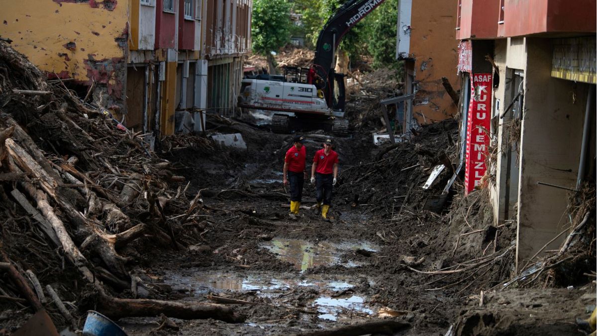 Rescue workers walk in a street in Bozkurt town of Kastamonu province.