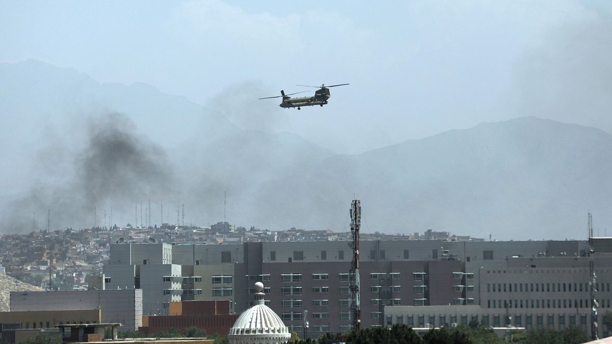 A U.S. Chinook helicopter flies over the city of Kabul, Afghanistan, Sunday, Aug. 15, 2021. 