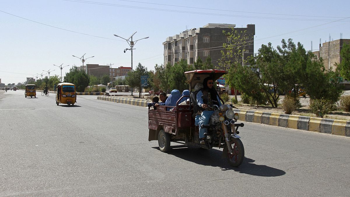 Afghans travel in motorcycle carts west of Kabul in Herat province.