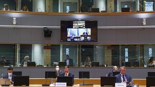 Josep Borrell is seen on a screen as he takes part in an extraordinary Foreign Affairs Council addressing the situation in Afghanistan, in Brussels, on August 17, 2021.