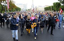 Protesters march during a protest against mandatory vaccinations, in Riga, Latvia