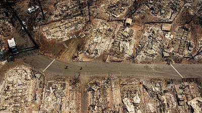 Aerial images show residences at Creekside Mobile Home Park destroyed after the Cache fire ripped th