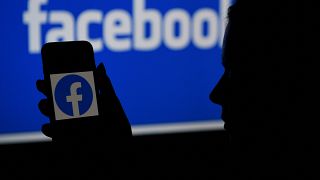 (FILES) In this file photo illustration, a smart phone screen displays the logo of Facebook