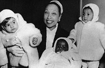 Actress Josephine Baker is in her apartment at the Hotel Forresta near Stockholm, Sweden on Dec. 7, 1957, with three of her adopted children.
