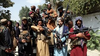 Taliban fighters pose for a photograph in Kabul, Afghanistan