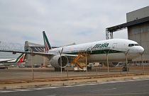 A Boeing 777 bearing the Alitalia livery is parked at Rome's Fiumicino international airport on March 17, 2020.