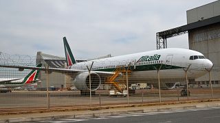A Boeing 777 bearing the Alitalia livery is parked at Rome's Fiumicino international airport on March 17, 2020.