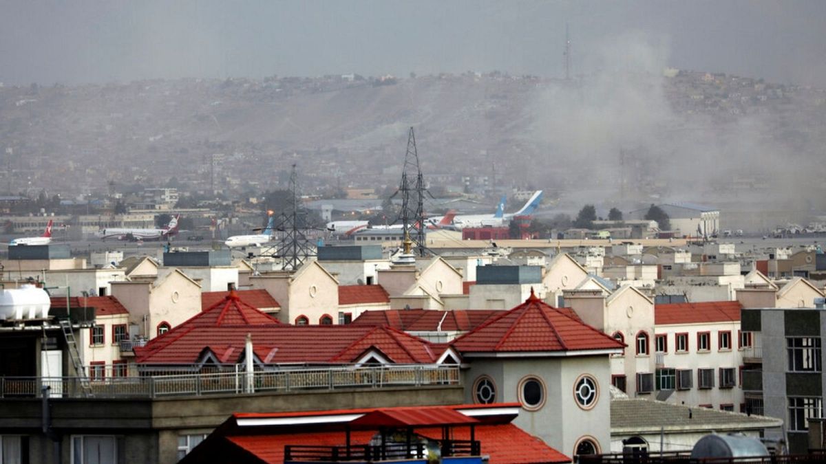 Smoke rises from a deadly explosion outside the airport in Kabul