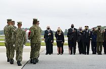 President Joe Biden watches as a Navy carry team moves a transfer case containing the remains of Navy Corpsman Maxton W. Soviak, 22, of Berlin Heights, Ohio, Sunday, Aug. 29.