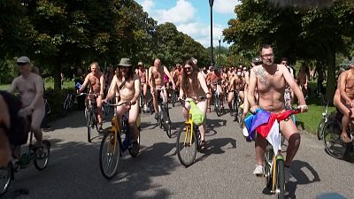 Naked cycle in Amsterdam for bike safety awareness