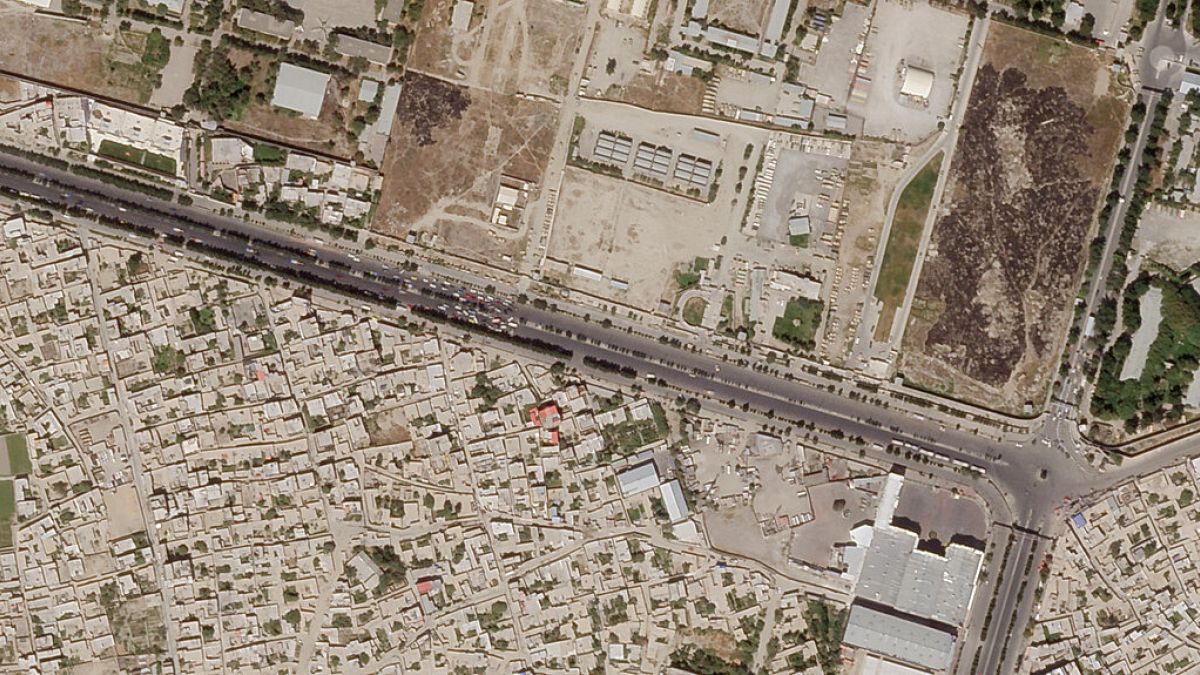 In this satellite photo taken by Planet Labs Inc., a Taliban checkpoint is seen blocking access just south of Kabul's international airport Saturday, Aug. 28, 2021. 