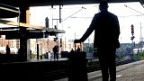 A passenger waits for his train at the main station in Duesseldorf, Germany, Tuesday, Aug. 24, 2021