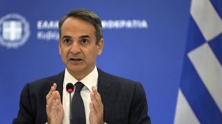 Greece's Prime Minister Kyriakos Mitsotakis speaks during a press conference in Athens, Aug. 12, 2021.