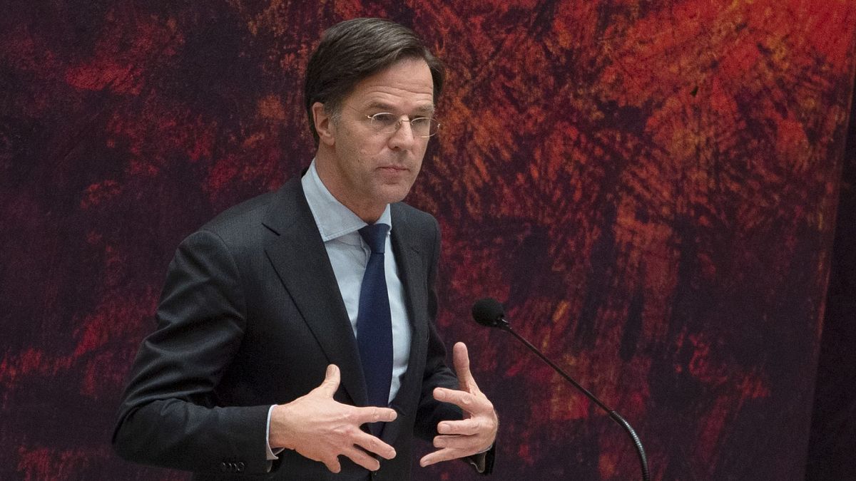 Caretaker Dutch Prime Minister Mark Rutte apologizes to other party leaders during a debate in parliament in The Hague, Netherlands, April 2, 2021.