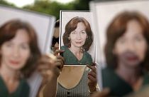 People hold portraits of Natalya Estemirova during a 2009 rally in Moscow.