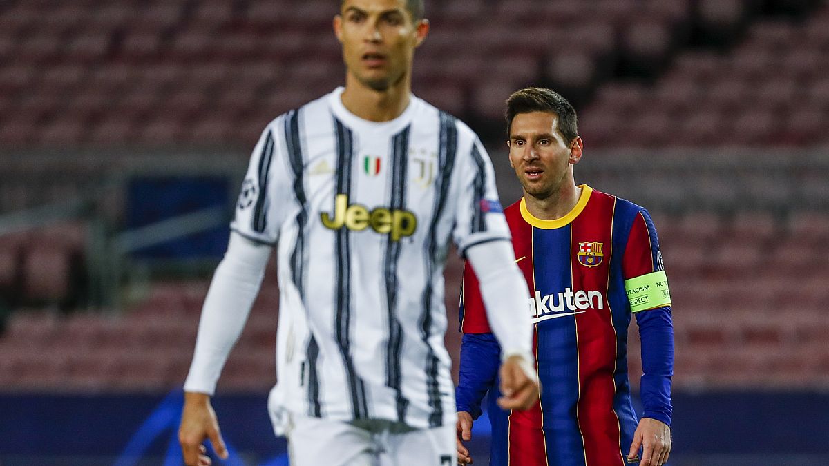 Barcelona's Lionel Messi, right, and Juventus' Cristiano Ronaldo during the Champions League match in Barcelona, Spain, Dec. 8, 2020.