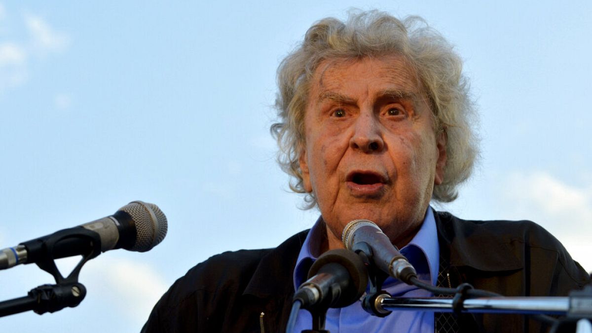 Greek composer Mikis Theodorakis gives a speech to a gathered crowd during a massive peaceful rally against austerity measures on Thursday, June 9, 2011